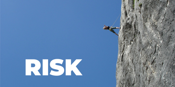 Image of a mountain climber to illustrate Risk with the word Risk